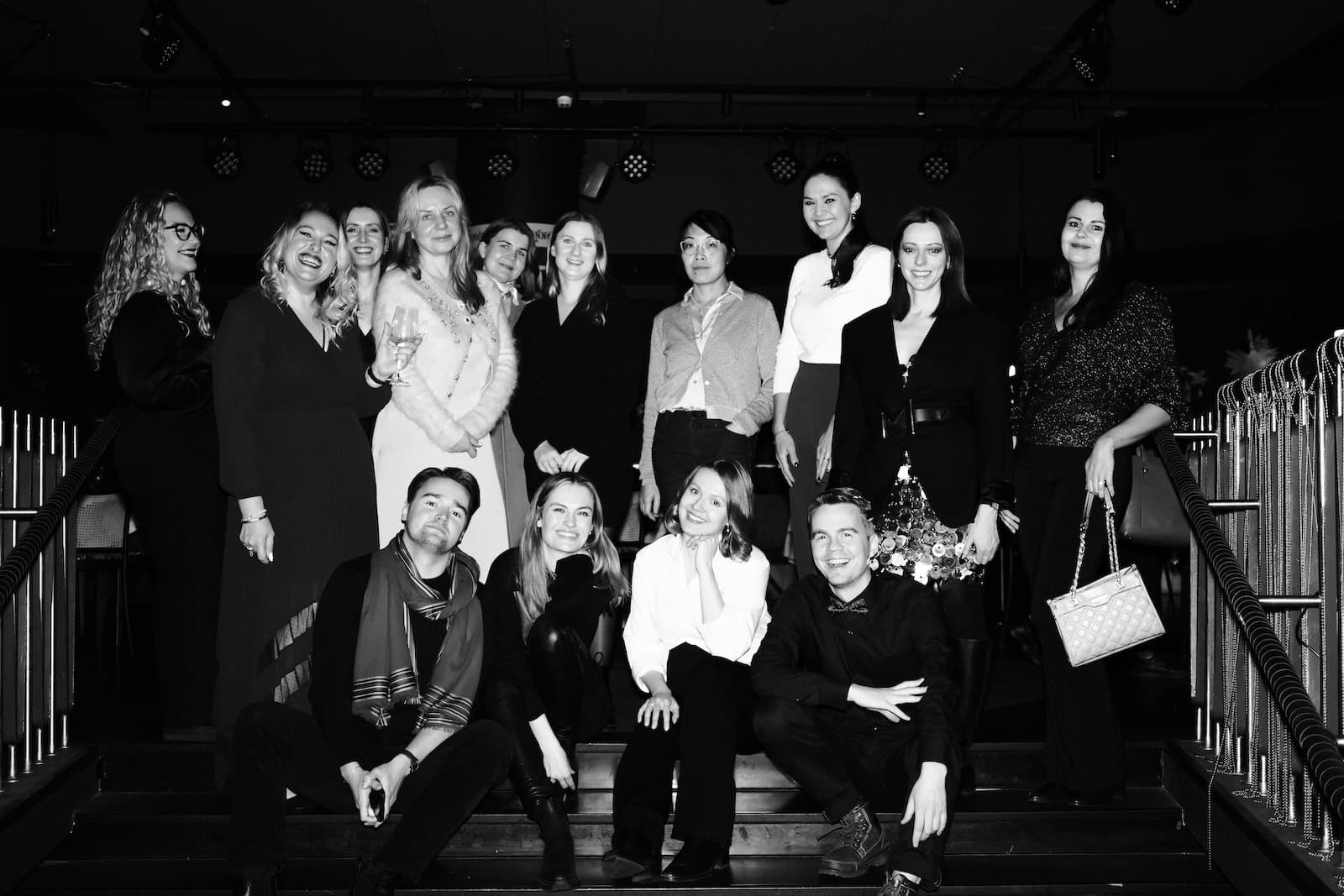 The club gathered on the stairs at the end of an evening in Helsinki