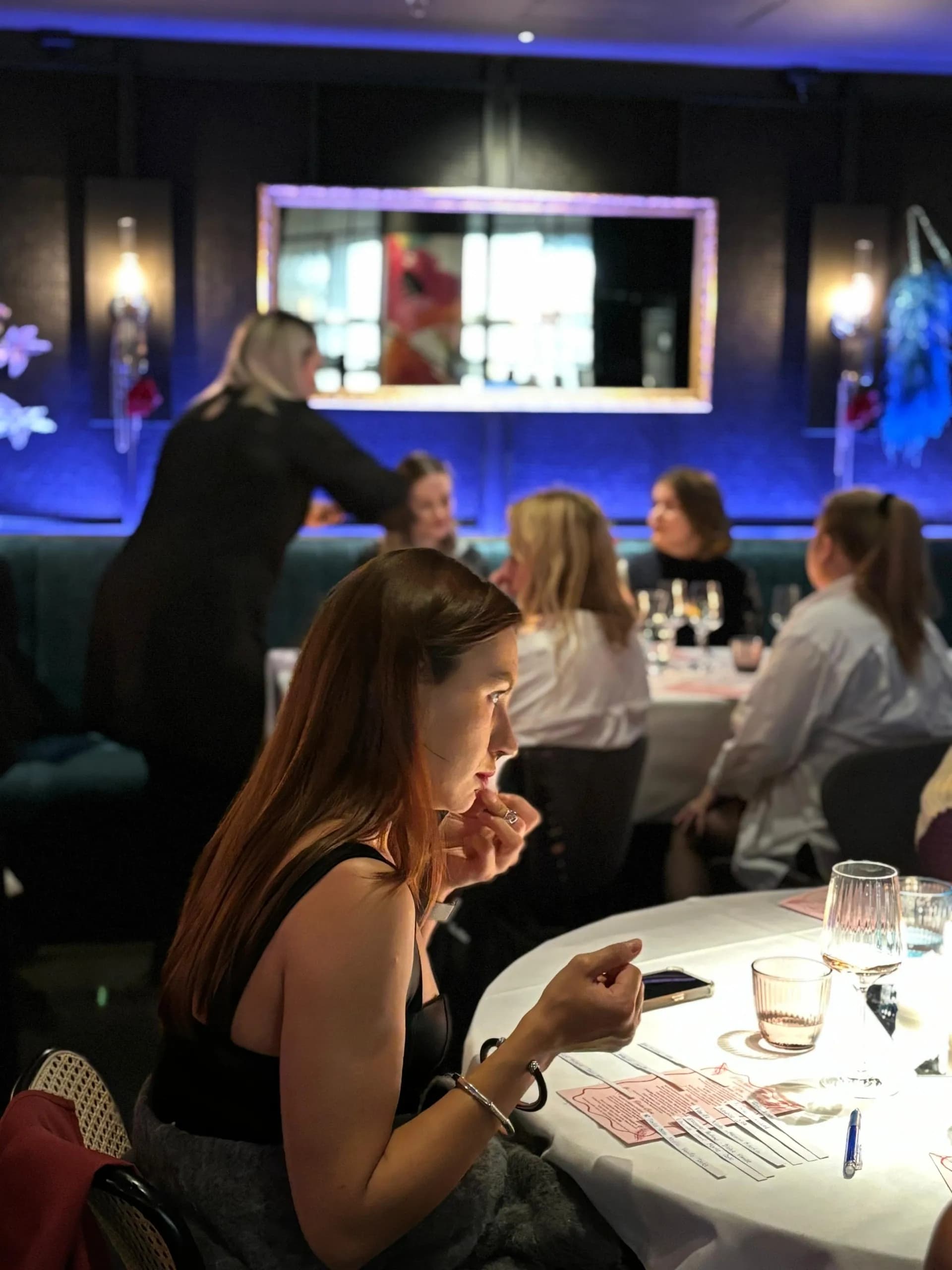 Guests smelling scent strips at a Scent Match evening